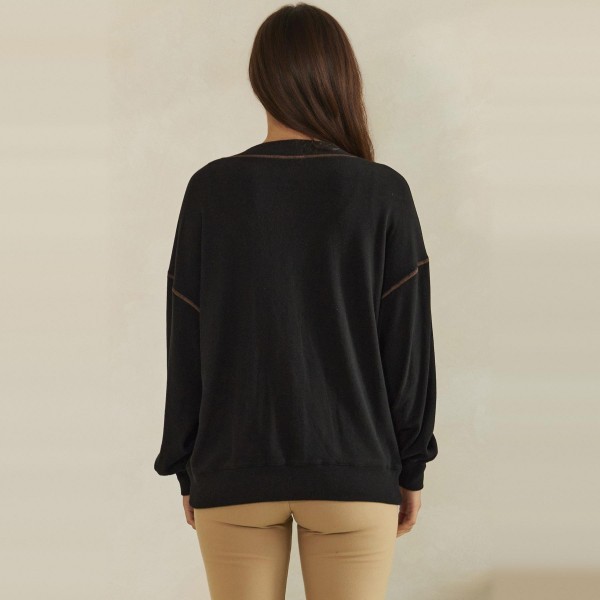 Button Front Knit Cardigan with a relaxed V neckline, dropped shoulders, and two roomy front pockets. The soft midweight knit layers easily over tanks, tees, and camis without adding bulk. Perfect for chilly mornings, office layering, and cozy weekend outfits from early fall straight through winter. A classic cardigan your customers will reach for again and again, making it a dependable repeat seller for boutique racks.