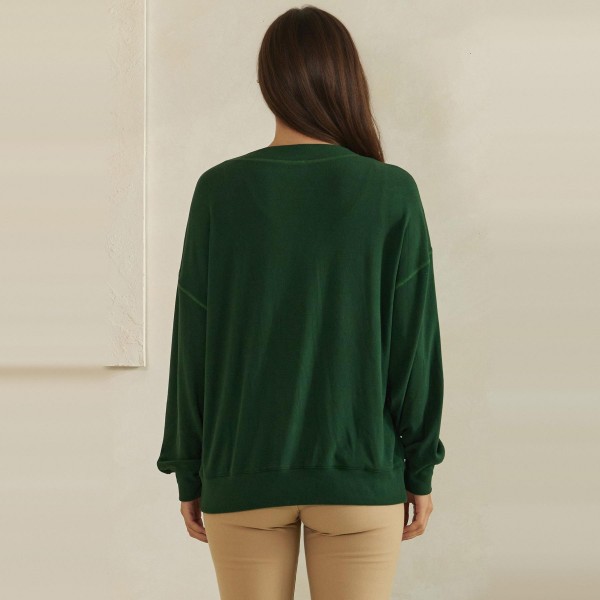Button Front Knit Cardigan with a relaxed V neckline, dropped shoulders, and two roomy front pockets. The soft midweight knit layers easily over tanks, tees, and camis without adding bulk. Perfect for chilly mornings, office layering, and cozy weekend outfits from early fall straight through winter. A classic cardigan your customers will reach for again and again, making it a dependable repeat seller for boutique racks.