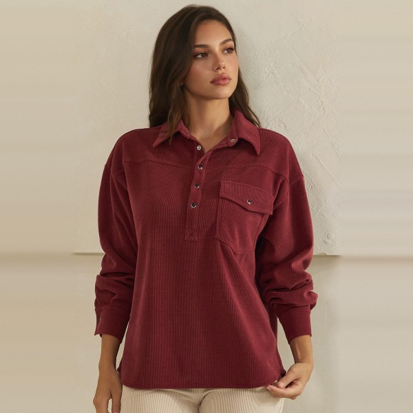 Corduroy Pullover Shirt with a classic point collar, half button placket, and flap chest pocket. The soft wale corduroy has a relaxed oversized fit with dropped shoulders and buttoned cuffs for an effortless, lived in look. Customers can wear it on its own with jeans or leggings, or layer it over a turtleneck for crisp fall days. A cozy statement top with a vintage inspired feel, this style is a natural fit for autumn displays and sells quickly.