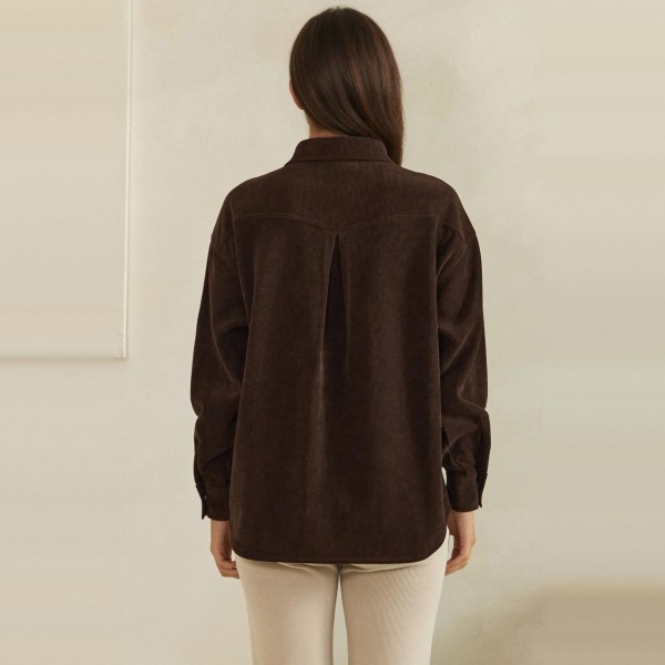 Corduroy Pullover Shirt with a classic point collar, half button placket, and flap chest pocket. The soft wale corduroy has a relaxed oversized fit with dropped shoulders and buttoned cuffs for an effortless, lived in look. Customers can wear it on its own with jeans or leggings, or layer it over a turtleneck for crisp fall days. A cozy statement top with a vintage inspired feel, this style is a natural fit for autumn displays and sells quickly.