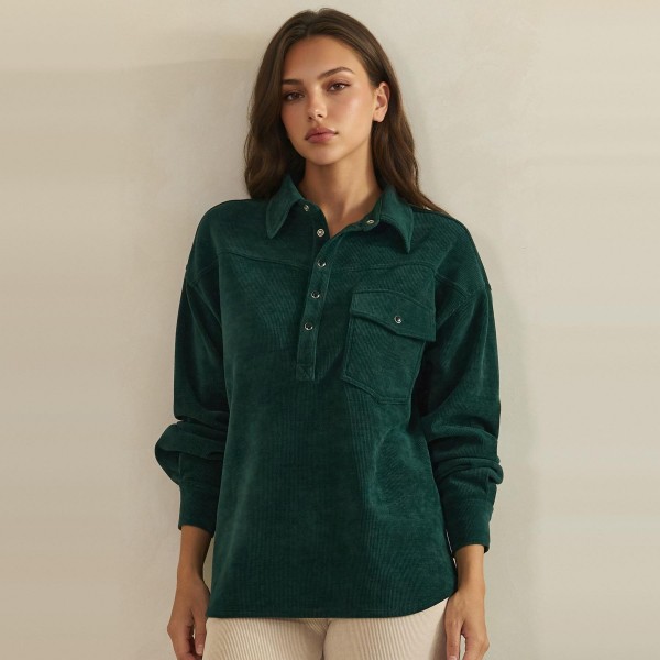 Corduroy Pullover Shirt with a classic point collar, half button placket, and flap chest pocket. The soft wale corduroy has a relaxed oversized fit with dropped shoulders and buttoned cuffs for an effortless, lived in look. Customers can wear it on its own with jeans or leggings, or layer it over a turtleneck for crisp fall days. A cozy statement top with a vintage inspired feel, this style is a natural fit for autumn displays and sells quickly.
