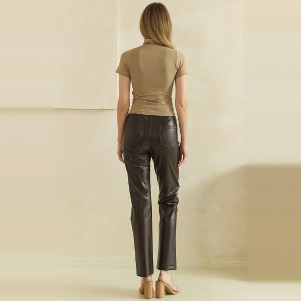 Faux Leather Five Pocket Pants with a classic jean inspired cut, button and zip closure, and a slim straight leg that hits right at the ankle. The soft vegan leather has a subtle sheen and smooth finish that looks polished without feeling stiff. Easy to style with sweaters, blazers, and booties for work, holiday parties, or a night out. Faux leather remains one of the strongest fall and winter categories, and this familiar fit makes it an easy sell for every customer.