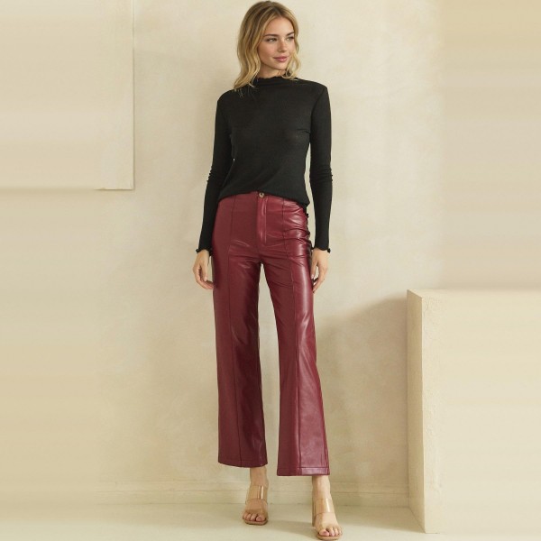 High Waisted Faux Leather Straight Leg Pants with sewn front seam detail that creates a long, lean line from waist to hem. Made from soft vegan leather with a button and zip closure and a relaxed straight leg that flatters every figure. Customers can pair them with a fitted turtleneck and heels for date night or a cozy knit and sneakers for the weekend. A polished fall and winter staple that delivers the luxe look shoppers want at a boutique friendly price.