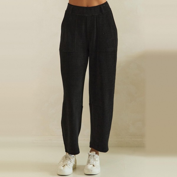 Ribbed Straight Leg Pants in a soft corduroy style knit with a smooth elastic waistband and functional front patch pockets. The relaxed straight leg hits at the ankle for a polished yet comfortable fit that works from the office to weekend errands. Pair them with cardigans, tucked tees, or chunky sweaters for easy fall and winter outfits your customers will wear on repeat. A comfortable pull on style at a friendly price point, these textured pants sell through fast all season.