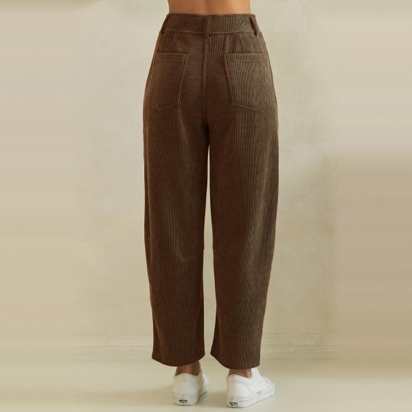 Ribbed Straight Leg Pants in a soft corduroy style knit with a smooth elastic waistband and functional front patch pockets. The relaxed straight leg hits at the ankle for a polished yet comfortable fit that works from the office to weekend errands. Pair them with cardigans, tucked tees, or chunky sweaters for easy fall and winter outfits your customers will wear on repeat. A comfortable pull on style at a friendly price point, these textured pants sell through fast all season.