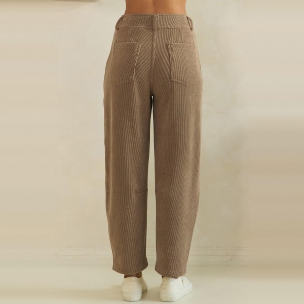 Ribbed Straight Leg Pants in a soft corduroy style knit with a smooth elastic waistband and functional front patch pockets. The relaxed straight leg hits at the ankle for a polished yet comfortable fit that works from the office to weekend errands. Pair them with cardigans, tucked tees, or chunky sweaters for easy fall and winter outfits your customers will wear on repeat. A comfortable pull on style at a friendly price point, these textured pants sell through fast all season.