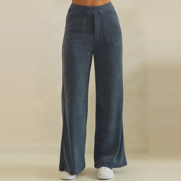Ribbed Wide Leg Pants with a soft corded knit texture, comfortable elastic waistband, and roomy front patch pockets. The relaxed high rise fit falls into a full length wide leg that drapes beautifully and flatters every shape. Customers can dress them up with a fitted knit and boots or keep it cozy with a sweatshirt and sneakers for fall weekends, travel days, and casual Fridays. Easy to fit and endlessly versatile, these comfy fall pants are a reliable repeat seller for any boutique.