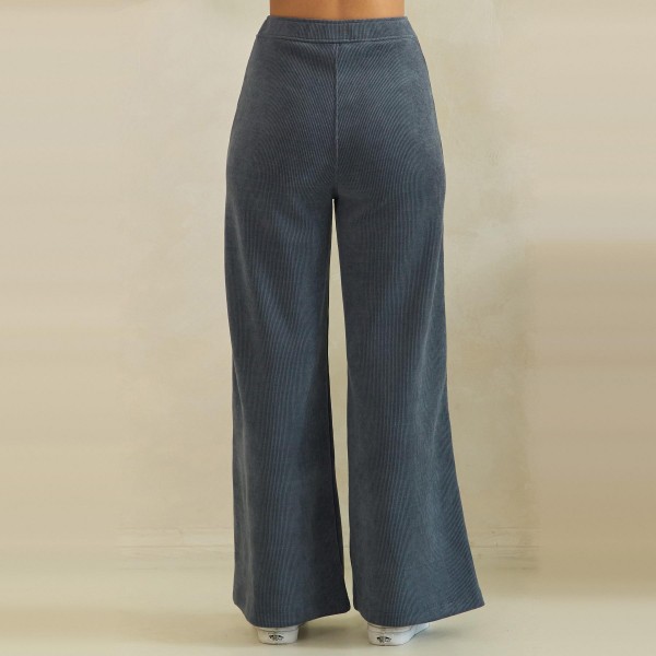 Ribbed Wide Leg Pants with a soft corded knit texture, comfortable elastic waistband, and roomy front patch pockets. The relaxed high rise fit falls into a full length wide leg that drapes beautifully and flatters every shape. Customers can dress them up with a fitted knit and boots or keep it cozy with a sweatshirt and sneakers for fall weekends, travel days, and casual Fridays. Easy to fit and endlessly versatile, these comfy fall pants are a reliable repeat seller for any boutique.