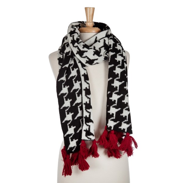 Black and white hounds tooth open scarf with red tassels. Approximately 72 x 20100% acrylic. 