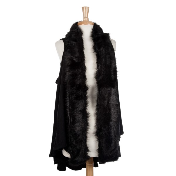 Black vest with a faux fur trim. 100% acrylic. One size fits most. 
