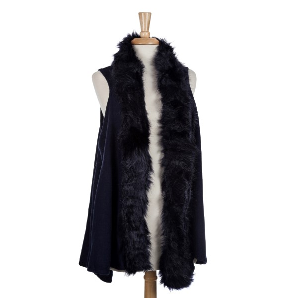 Navy blue vest with a faux fur trim. 100% acrylic. One size fits most. 