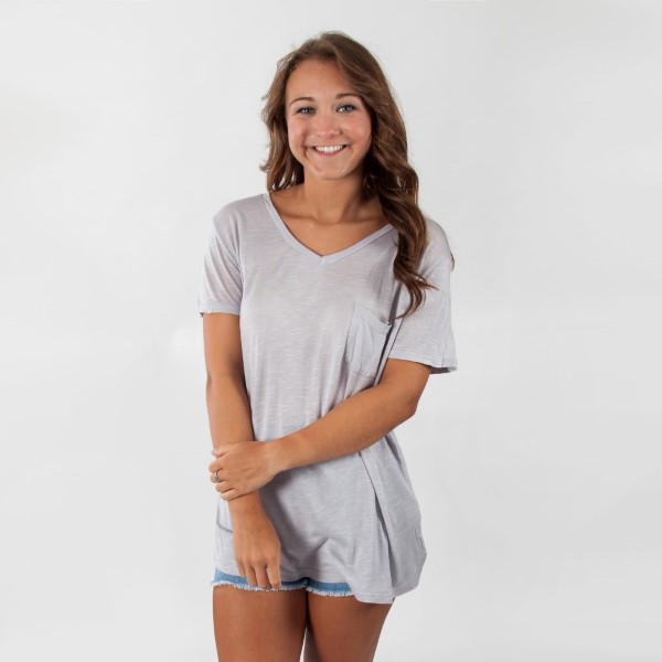Lightweight gray top with short sleeves, a pocket on the left chest and a V-neckline. 100% rayon. Sold in packs of six - two smalls, two mediums, and two larges. 