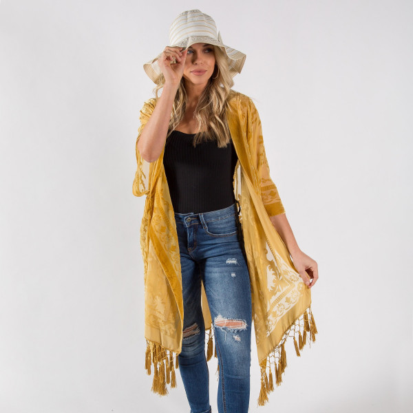 Gold floral kimono with tassels. One size fits most 0-14. Measures approximately 42" x 36" in size. 50% Viscose, 50% Nylon.