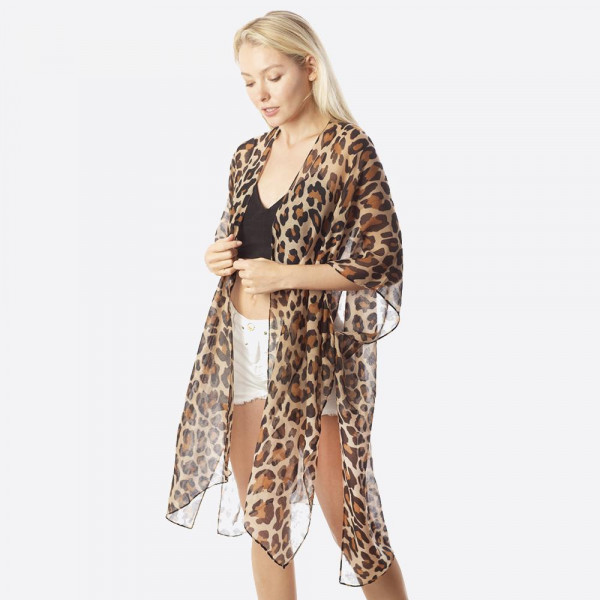 Women's Lightweight Sheer Leopard Print Kimono. 

- One size fits most 0-14
- Approximately 37" L
- 100% Polyester
