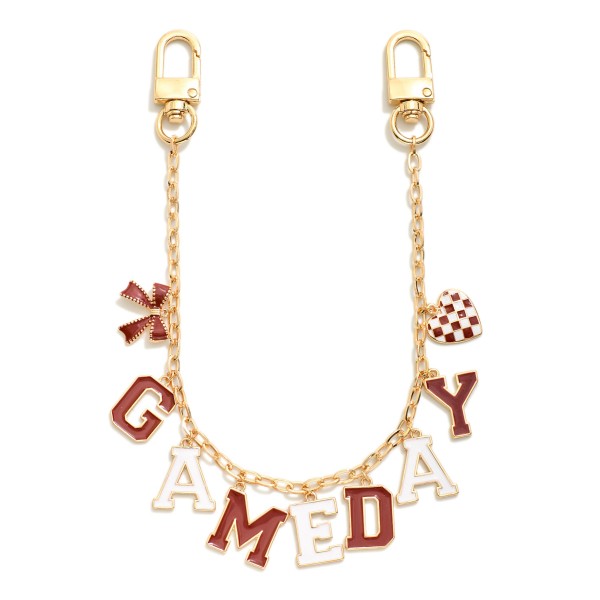 Gold Tone "Game Day" Chain Link Bag Charm Featuring Bow And Heart Charm 

- Approximately 14" L 