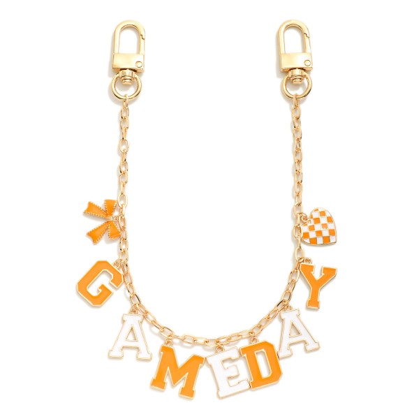 Gold Tone "Game Day" Chain Link Bag Charm Featuring Bow And Heart Charm 

- Approximately 14" L 