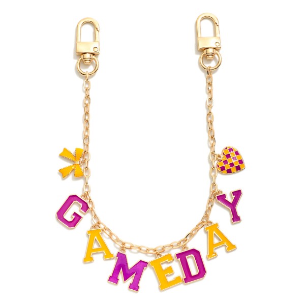 Gold Tone "Game Day" Chain Link Bag Charm Featuring Bow And Heart Charm 

- Approximately 14" L 