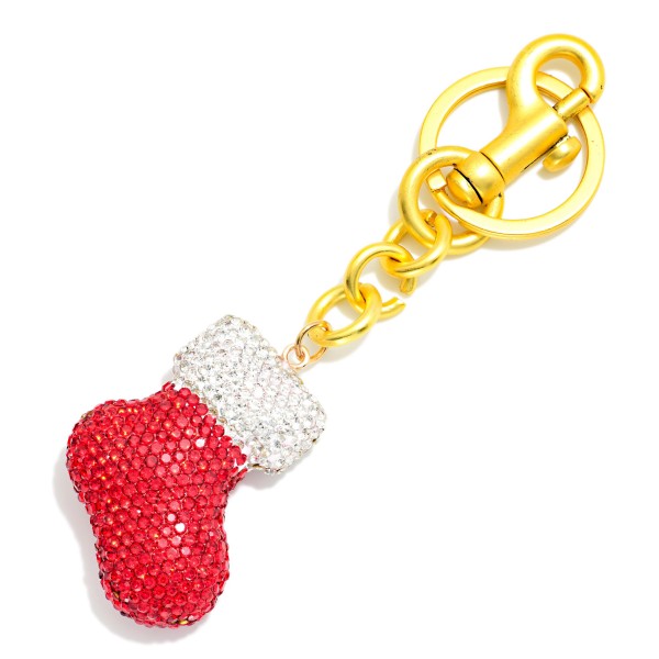 Rhinestone Christmas Stocking Keychain shaped like a classic holiday stocking and covered in sparkling crystals, finished with a swivel clasp and key ring. Clip it to keys, purses, backpacks, or bag straps for festive shine all season. Perfect for stocking stuffers, teacher gifts, and Secret Santa swaps. These sparkly holiday keychains sell fast at the register from November through Christmas.
