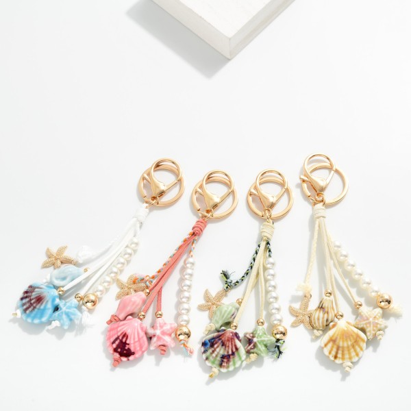 Beach Key Ring Featuring Shells, Pearls, & Gold Tones 

- Approximately 6" L 
