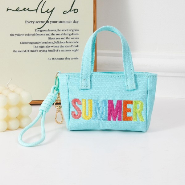 A fun and fashion-forward structured mini handbag featuring bold 'SUMMER' lettering in vibrant multicolor embroidery, with a removable wrist strap for hands-free convenience. The compact boxy design works perfectly as a daytime grab-and-go bag, beach accessory, or festival essential. Ideal for boutiques refreshing their warm-weather accessories assortment, this eye-catching piece drives impulse purchases and pairs effortlessly with seasonal apparel. A cheerful, trend-right addition customers will reach for all summer long.