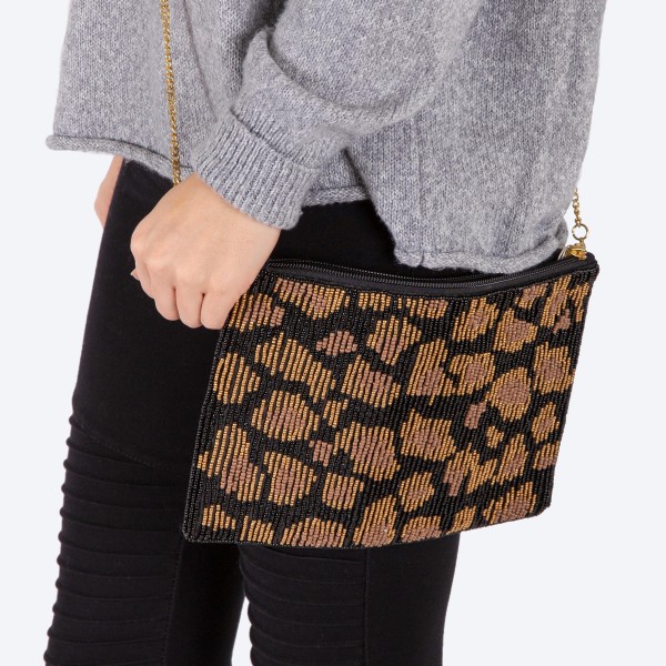 High Quality Seed Beaded Leopard Print Crossbody.

- Zipper closure
- One inside open pocket
- Inside lining 100% Cotton
- Approximately 10.5" W x 7" T
- Chain Strap approximately 52" L
- Approximately 62" L overall
- 40% Seed beads, 40% Cotton Canvas, 20% Metal
