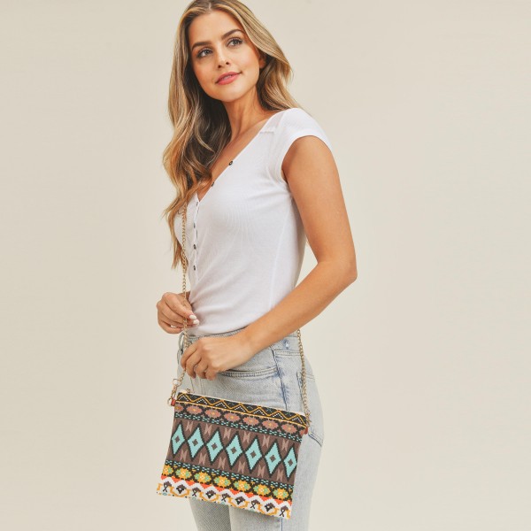 Multi Colored Aztek Print Canvas Cross Body Handbag

- Zipper Closure
- Lined
- Two Internal Pockets
- Adjustable Faux Leather and Chain Link Strap
- Detachable Wristlet Strap
- Approximately 10" L x 8" W
