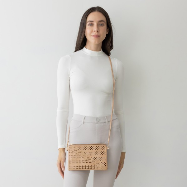Laser Cut Tribal Pattern Leather Envelope Crossbody Handbag With Diagonal Leather Stripe Accent and Removable Thin Leather Strap

- Zipper Closure
- Lined Inside
- One External Back Pocket
- Strap Drop Length Approximately 26" Long
- Approximately 6" Tall x 9" Long x 1" Wide
- 100% PU