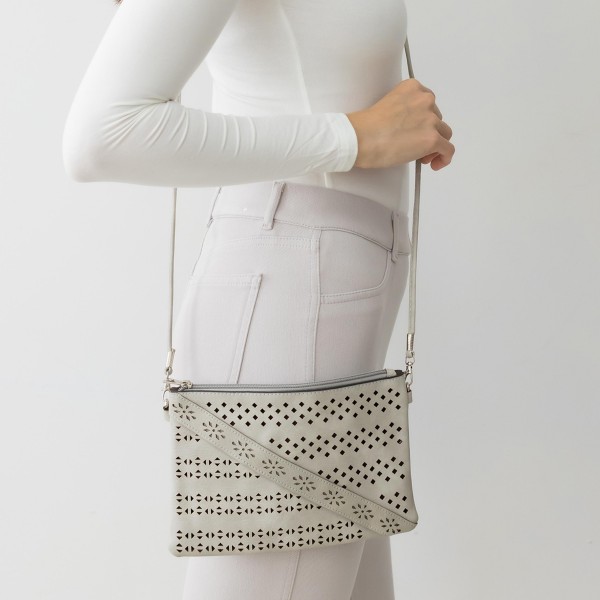 Laser Cut Tribal Pattern Leather Envelope Crossbody Handbag With Diagonal Leather Stripe Accent and Removable Thin Leather Strap

- Zipper Closure
- Lined Inside
- One External Back Pocket
- Strap Drop Length Approximately 26" Long
- Approximately 6" Tall x 9" Long x 1" Wide
- 100% PU