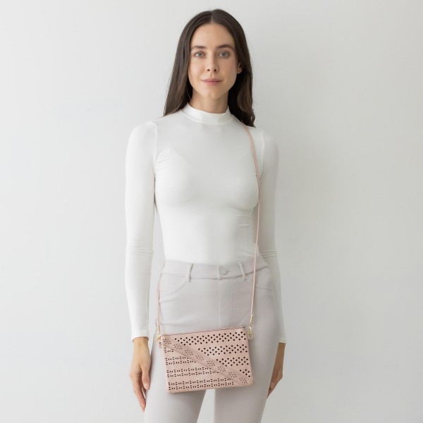 Laser Cut Tribal Pattern Leather Envelope Crossbody Handbag With Diagonal Leather Stripe Accent and Removable Thin Leather Strap

- Zipper Closure
- Lined Inside
- One External Back Pocket
- Strap Drop Length Approximately 26" Long
- Approximately 6" Tall x 9" Long x 1" Wide
- 100% PU