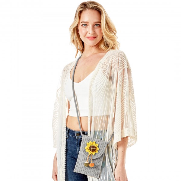 Knit Envelope Crossbody Handbag Featuring Sunflower Applique

- Magnetic Closure
- Strap Drop Length Approximately 23" L
- Approximately 8" H x 4.75" W
- 100% Cotton