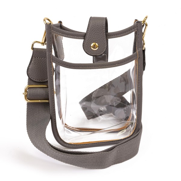 Clear PU Handbag With Matching Strap and Leather Hemlines

- Magnetic Closure
- One Outer Pocket
- Adjustable and Removable Canvas Strap Approximately 14" - 23" Drop
- Approximately 8"T x 6"L x 2"W
- Material: PU