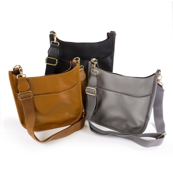 Solid Color Leather Handbag With Matching Strap

- Magnetic Closure
- One Outer Pocket
- Three Inner Pockets / One With Zipper Closure
- Adjustable and Removable Canvas Strap Approximately 14" - 23" Drop
- Approximately 10"T x 10"L x 2"W
- Material: Leather