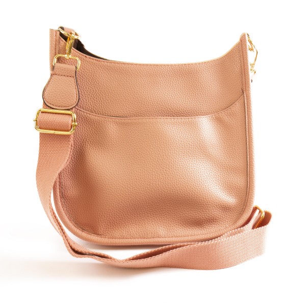 Solid Color Leather Handbag With Matching Strap

- Magnetic Closure
- One Outer Pocket
- Three Inner Pockets / One With Zipper Closure
- Adjustable and Removable Canvas Strap Approximately 14" - 23" Drop
- Approximately 10"T x 10"L x 2"W
- Material: Leather