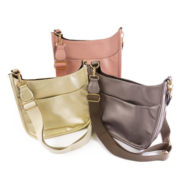 Solid Color Leather Handbag With Matching Strap

- Magnetic Closure
- One Outer Pocket
- Three Inner Pockets / One With Zipper Closure
- Adjustable and Removable Canvas Strap Approximately 14" - 23" Drop
- Approximately 10"T x 10"L x 2"W
- Material: Leather