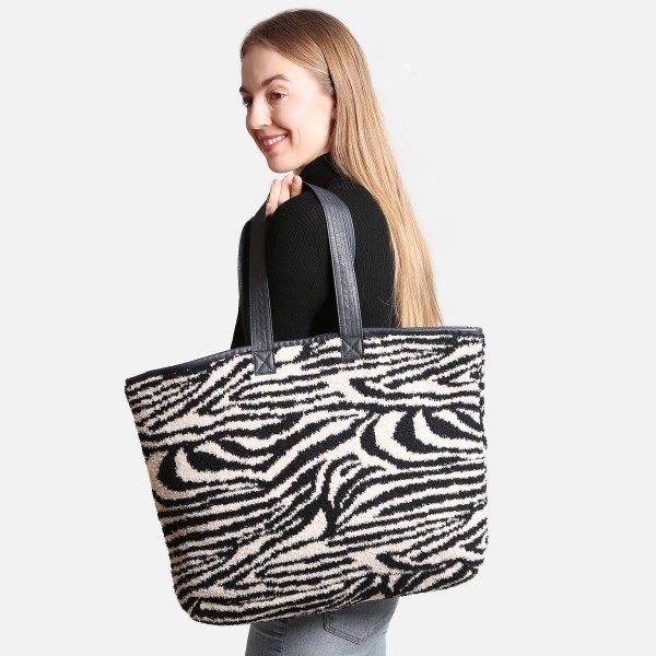 ComfyLuxe Zebra Print Knit Tote Bag

- Lined
- Magnetic Closure
- Two Internal Pockets
- Approximately 20" H x 40" W
- Handle Approximately 10" Drop
- 100% Poly Microfiber