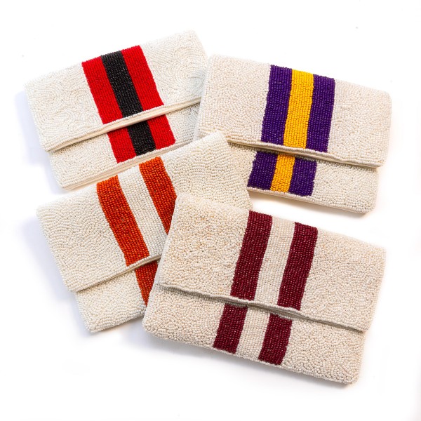 Beaded Red And Black Stripe Handbag

- Magnetic Closure
- Approximately 7.5" L X 5" W
- Open Inside Pocket Approximately 3" L/W
- Gold Cross Body Removable Chain Approximately 22" L
- Spot Clean Only
-100% Cotton Canvas Bag