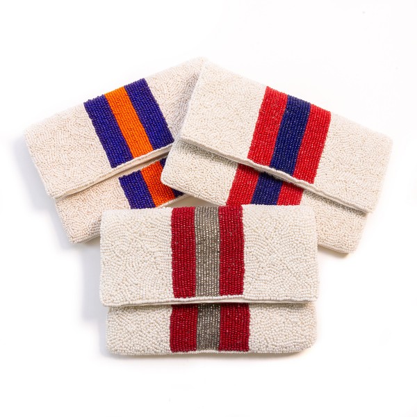 Beaded Purple And Orange Stripe Handbag 

- Magnetic Closure 
- Approximately 7.5" L X 5" W
- Open Inside Pocket Approximately 3" L/W
- Silver Cross Body Removable Chain Approximately 22" L
- Spot Clean Only
-100% Cotton Canvas Bag 