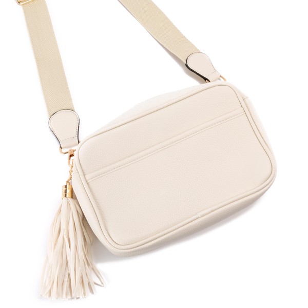 Solid Color Leather Handbag With Matching Strap and Tassel Keychain

- Lined Inside
- Zipper Closure
- Two Large Inner Pockets / One With Zipper Closure
- Adjustable and Removable Canvas Strap Approximately 14" - 23" Drop
- Approximately 6"T x 10"L x 2.5"W
- Material: Faux Leather