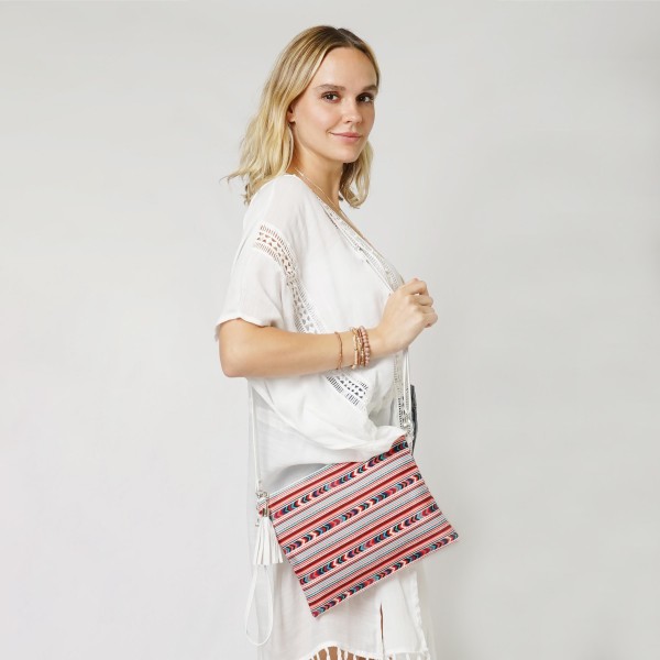 Aztec Print Canvas Bag With Faux Leather Tassel

- Full Zipper Closure
- Fully Lined Inside
- 100% Polyester
- Wristlet: Approximately 7.5" W X 5" D (Removable Strap Included)
- Cross Body Handbag: Approximately 11" W X 8.5" D
- Handbag Includes Removable Wristlet and Adjustable Faux Leather Strap (Drop 11" -23" L)