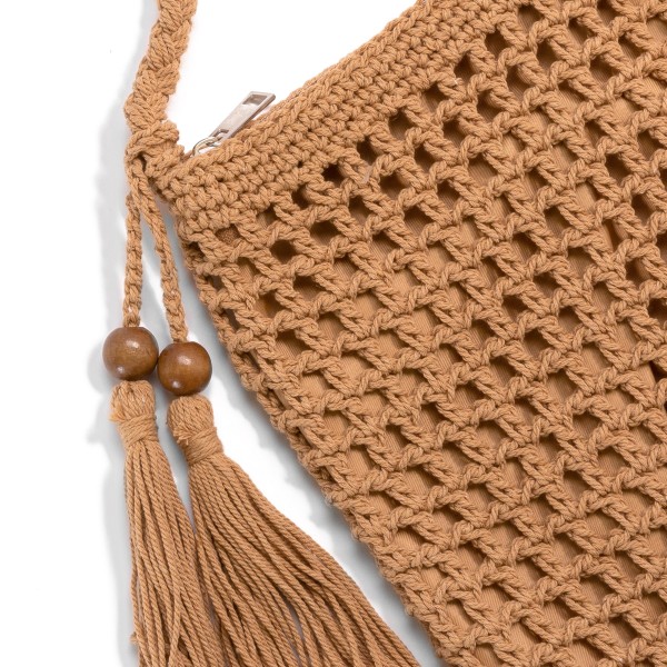 Crocheted Cross Body Handbag With Wood Bead Tassel Accent

- Full Zip Closure
- Lined
- Approximately 23"L Drop
- Approximately 8"W x 9"H