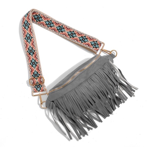 Faux Suede Fringe Sling Bag With Guitar Strap

- Lined Body 
- Full Zipper Closure With One Zipper & One Open Internal Pocket
- Body Approximately 12" W X 5" T 
- Removable Adjustable Guitar Strap (26"-50")  