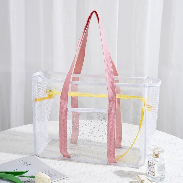 Clear Tote Bag With Mesh Netting and Glitter Stars Detail

- Zip Closure
- One Outer Front Pocket / Two Inner Mesh Net Pockets
- Approximately 13" L x 10" T x 6" D
- Handle Drop 8" L
- 100% PVC