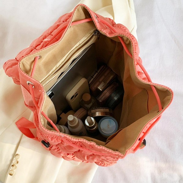 Nylon Quilted Puffer Backpack With Magnetic Flap Closure 
- Drawstring Closure
- 1 Front Magnetic Pocket
- 1 Back Zipper Pocket 
- Lined Body
- 2 Internal Pockets- 1 Zipper & 1 Open
- Approximately 12" T X 14" L X 7" D