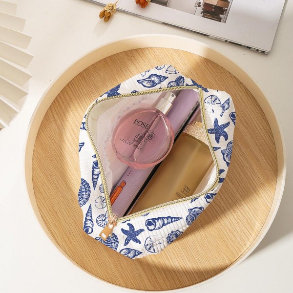 Sea Shells Corduroy Make Up Pouch
- Full Zipper Closure
- One Open Pocket
- Approximately 5" T X 6" L X 3" D