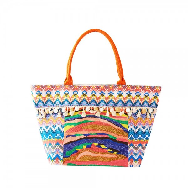 Abstract Chevron Printed Canvas Tote Bag With Fringe Pom Detail	
	
- Full Zip Closure	
- Fully Lined Body With Internal Open Pocket	
- 100% Polyester	
- Approximately 21" W X 14.5" T X 5" D	
- 10" Strap Drop