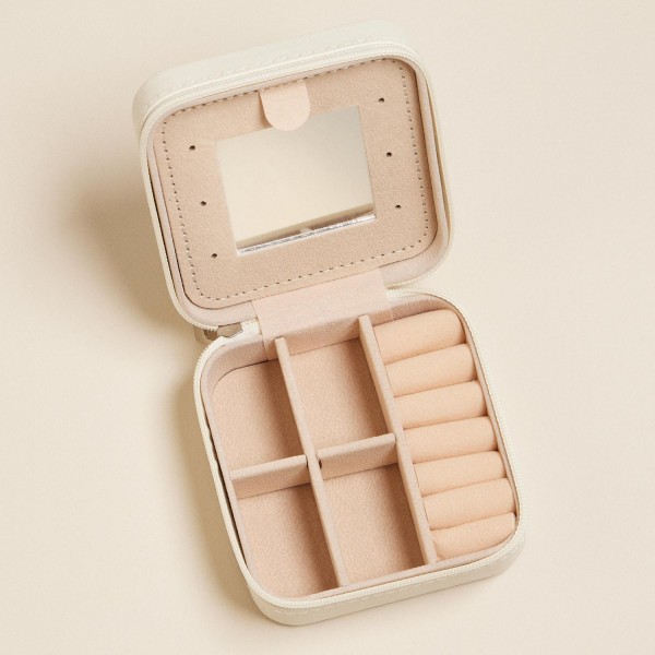 Stripes & Bows Print Vegan Leather Travel Jewelry Box
- Full Zipper Closure
- Mirror & Earring Holder Divider
- Removable Divider Organizer
- 6 Ring Slots & 3 Necklace Hooks
- Approximately 3.5" L X 3.75" T X 2" D