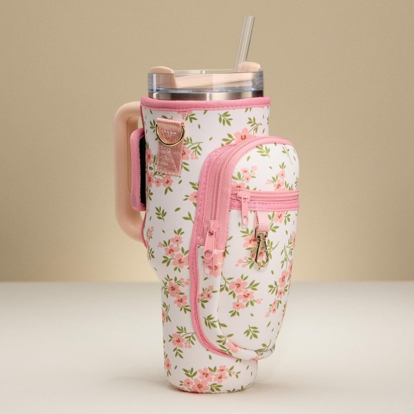 Crossbody Petite Pink Flowers Print Neoprene Tumbler Holder

- Fits 40oz Tumbler
- Velcro Closure
- 2 Zip Pockets
- 1 Lobster Claw Clip
- Removable Cross Body Strap
- Approximately 5" L X 10" T X 3" D