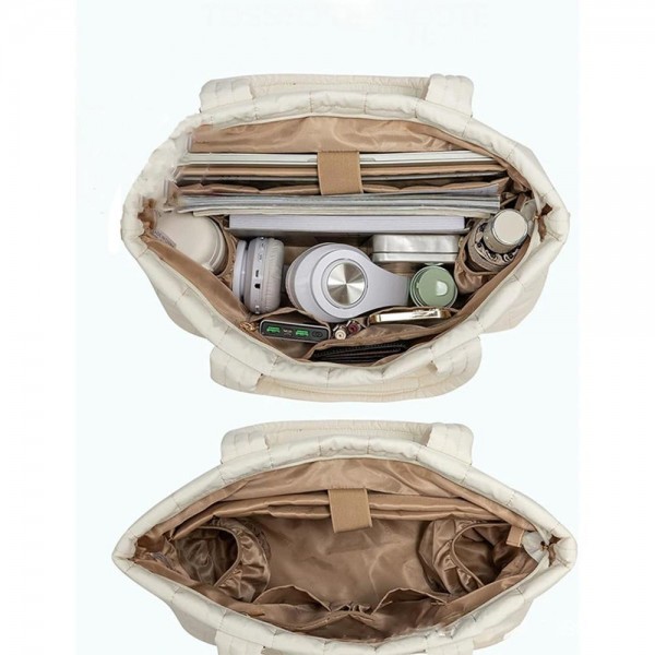 Nylon Quilted Tote Bag With Vegan Leather Accents 
- Full Zip Closure
- 1 External Zip Pocket 
- Laptop Pocket With Velcro Clasp
- 2 Open & 1 Zip Internal Pockets
- Quilted Wristlet Included
- Crossbody Strap Included
- Handle Drop 10" L
- Approximately 12" T X 19" L X 7" D