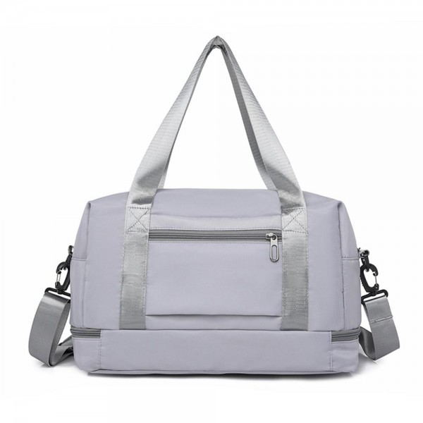 Nylon Duffle Tote Bag 

- Full Zip Closure
- Lined Body 
- 2 External Zip Pockets 
- Full Zip Drop Bottom Compartment 
- 2 Internal Mesh Open Pockets & 1 Internal Open Pocket 
- Removeable Cross Body Strap 
- Approximately  10" T X 16" L X 7" D