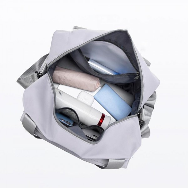 Nylon Duffle Tote Bag 

- Full Zip Closure
- Lined Body 
- 2 External Zip Pockets 
- Full Zip Drop Bottom Compartment 
- 2 Internal Mesh Open Pockets & 1 Internal Open Pocket 
- Removeable Cross Body Strap 
- Approximately  10" T X 16" L X 7" D